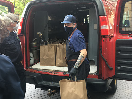 Chef Ryan McQuillan delivering EMS Lunches Donated by High Real Estate